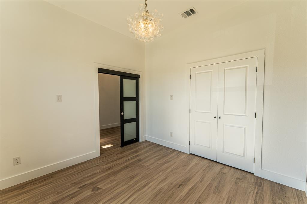 2147 Heath Street Sulphur Springs, TX 75482 - Photo 28 of 40 a view of an empty room with wooden floor