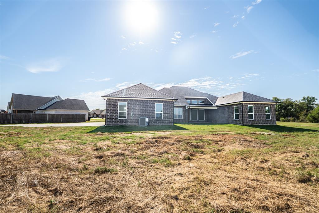 2147 Heath Street Sulphur Springs, TX 75482 - Photo 32 of 40 a front view of a house with a yard