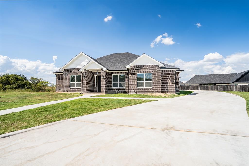 2147 Heath Street Sulphur Springs, TX 75482 - Photo 38 of 40 a front view of a house with a yard