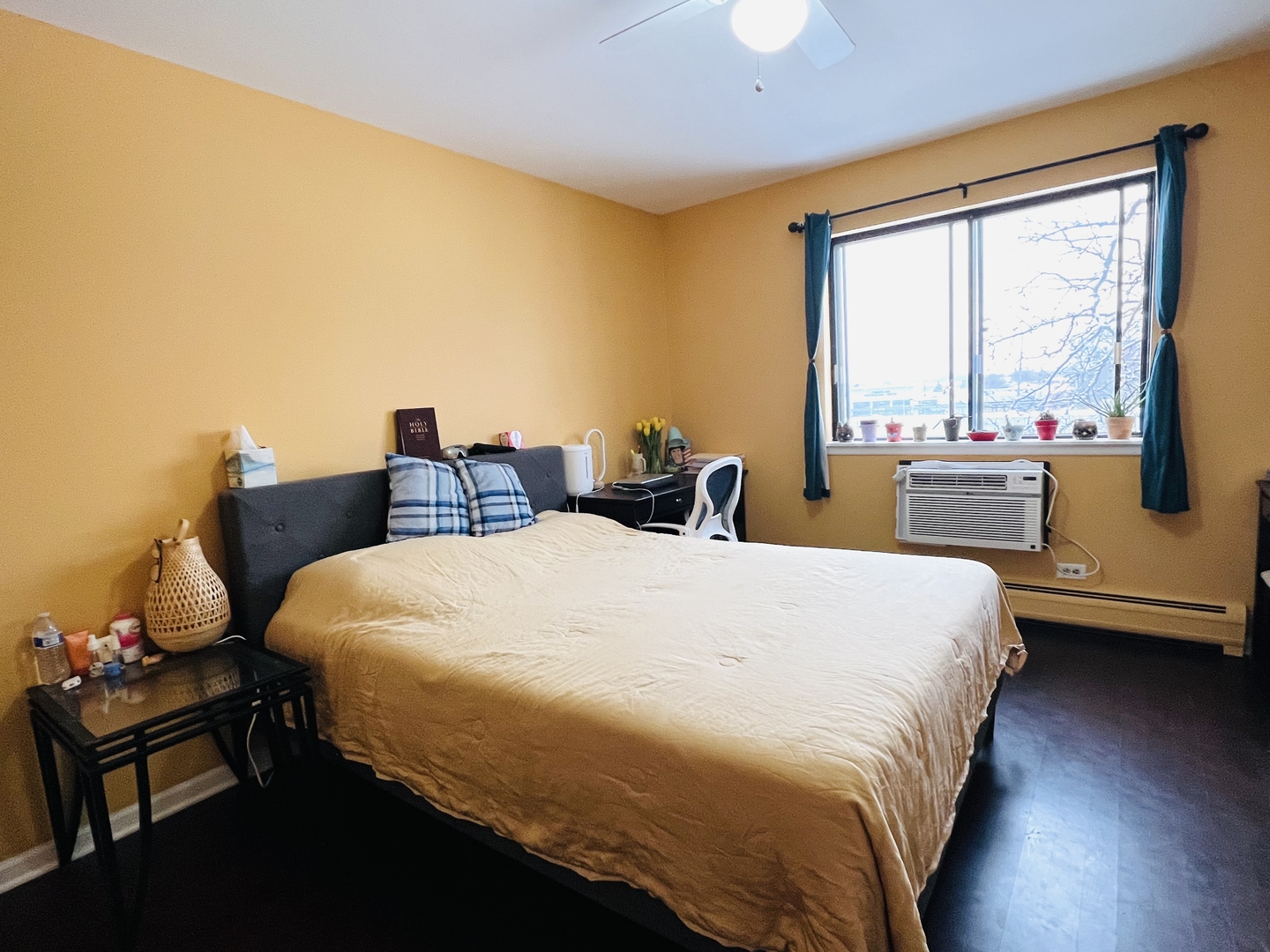 4624 North Commons Drive, Unit 307 Chicago, IL 60656 - Photo 13 of 18 a bedroom with a bed and wooden floor