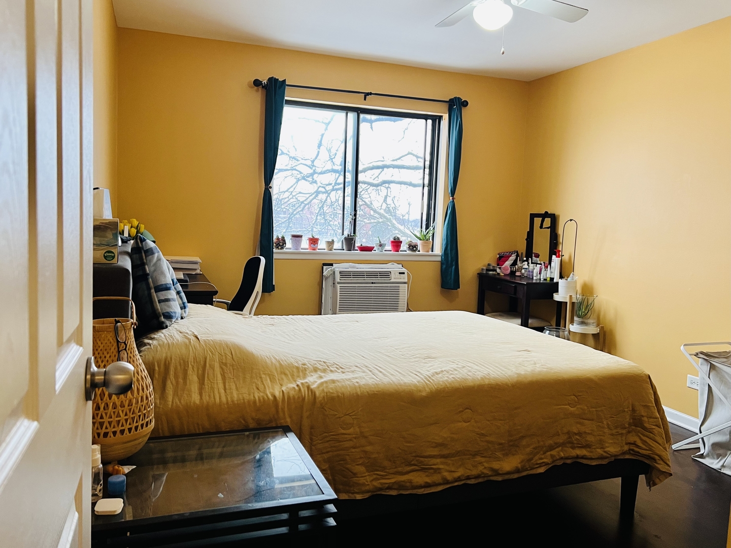4624 North Commons Drive, Unit 307 Chicago, IL 60656 - Photo 16 of 18 a bed sitting in a bedroom next to a window