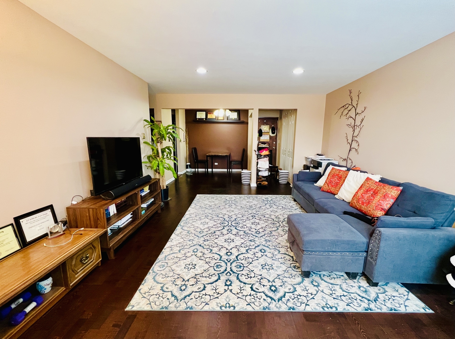 4624 North Commons Drive, Unit 307 Chicago, IL 60656 - Photo 7 of 18 a living room with furniture and a flat screen tv
