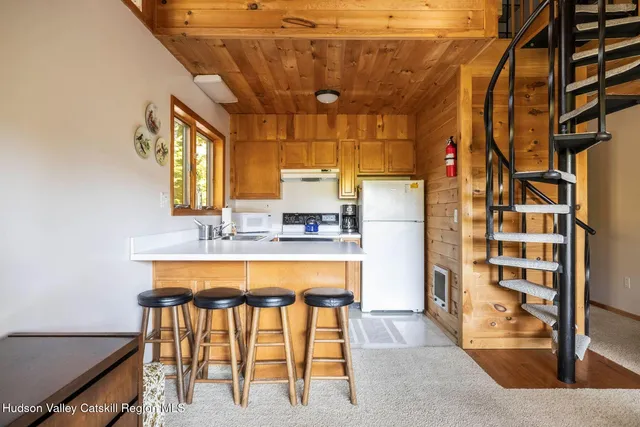 a bathroom with a sink a mirror and a shower