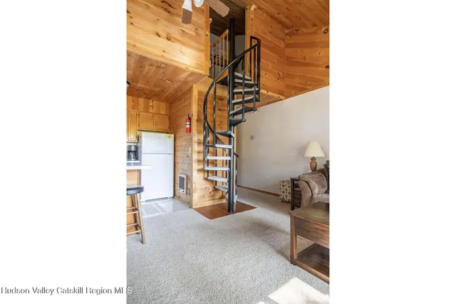 a view of a room with stairs and a living room