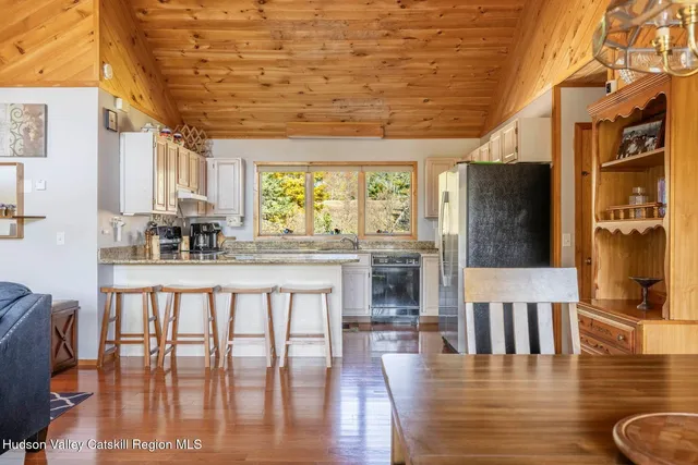a dining room with furniture window wooden floor