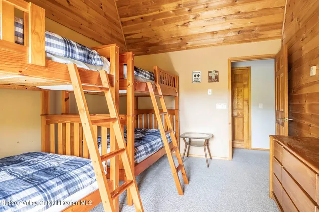 a view of a bedroom with furniture and staircase