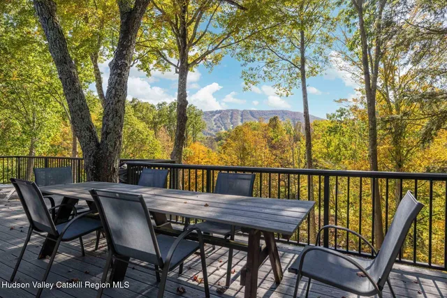 a view of a patio with furniture and trees