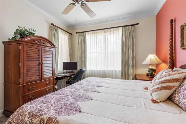 a bedroom with two beds and painting on the wall