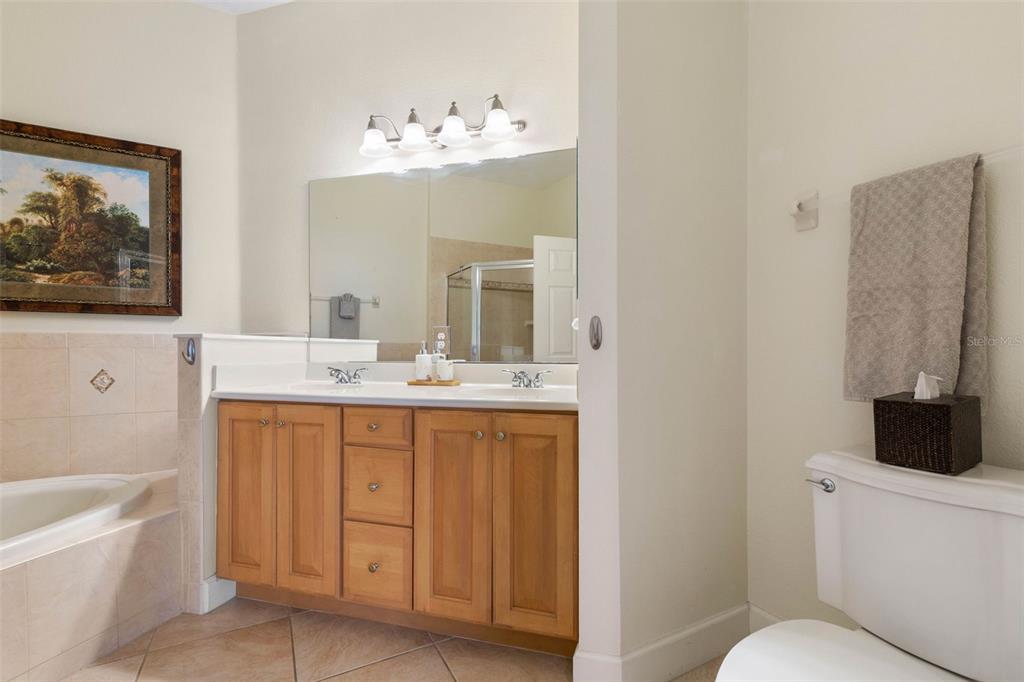 35 Ocean Crest Way, Unit 1124 Palm Coast, FL 32137 - Photo 20 of 81 a bathroom with a sink a toilet and a bathtub