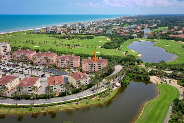 a living room with furniture a large window and a flat screen tv