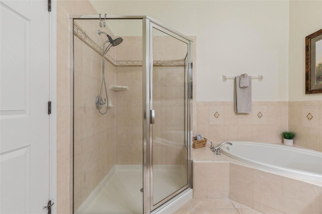 35 Ocean Crest Way, Unit 1124 Palm Coast, FL 32137 - Photo 22 of 81 a bathroom with a bathtub and a shower