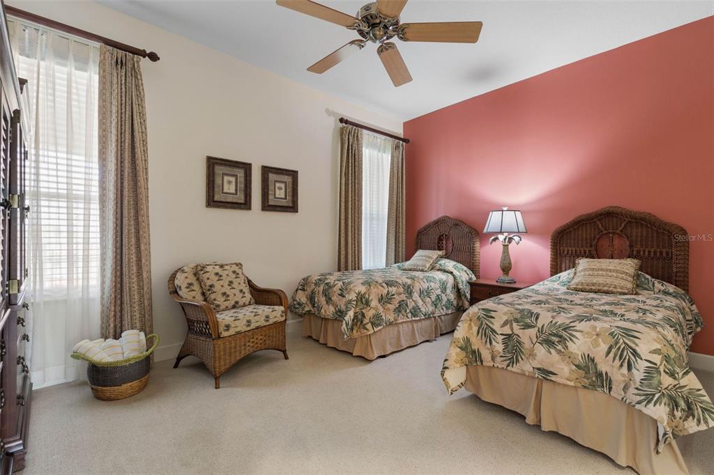 35 Ocean Crest Way, Unit 1124 Palm Coast, FL 32137 - Photo 23 of 81 a bedroom with two beds and painting on the wall