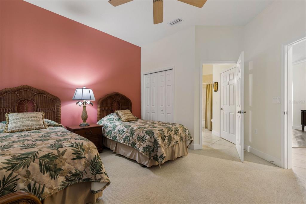 35 Ocean Crest Way, Unit 1124 Palm Coast, FL 32137 - Photo 25 of 81 a bedroom with two beds and painting on the wall