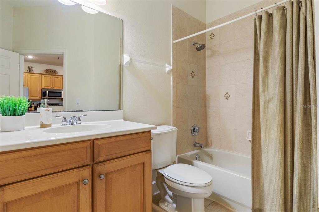 35 Ocean Crest Way, Unit 1124 Palm Coast, FL 32137 - Photo 26 of 81 a bathroom with a sink toilet vanity and shower