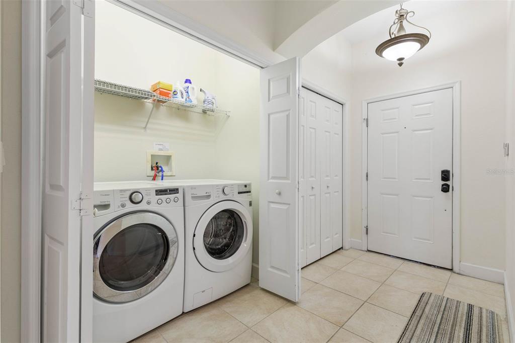 35 Ocean Crest Way, Unit 1124 Palm Coast, FL 32137 - Photo 28 of 81 a utility room with dryer and washer