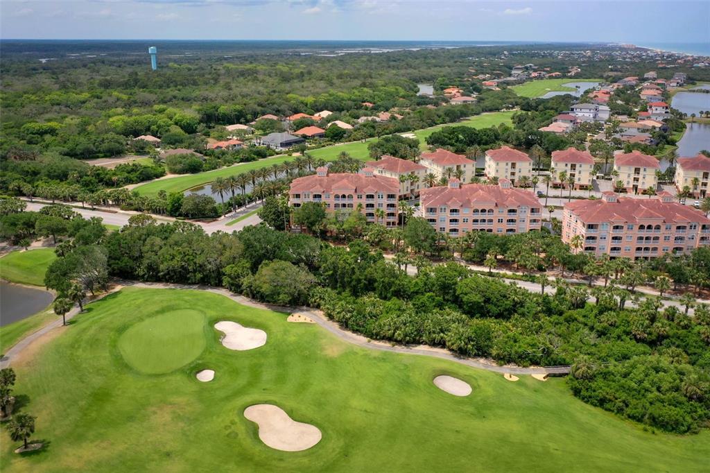 35 Ocean Crest Way, Unit 1124 Palm Coast, FL 32137 - Photo 37 of 81 an aerial view of a golf course with chairs