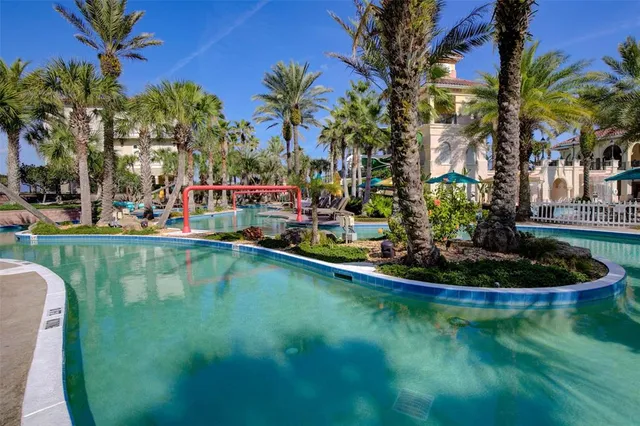 a living room with furniture a large window and a clock