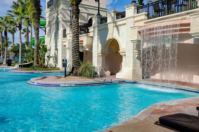 a living room with lots of furniture and a large window