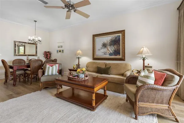 a dining room with furniture and chandelier