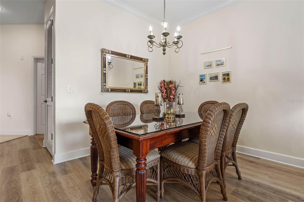 35 Ocean Crest Way, Unit 1124 Palm Coast, FL 32137 - Photo 8 of 81 a dining room with furniture and chandelier