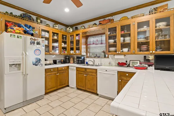 a kitchen with a cabinets a sink and appliances