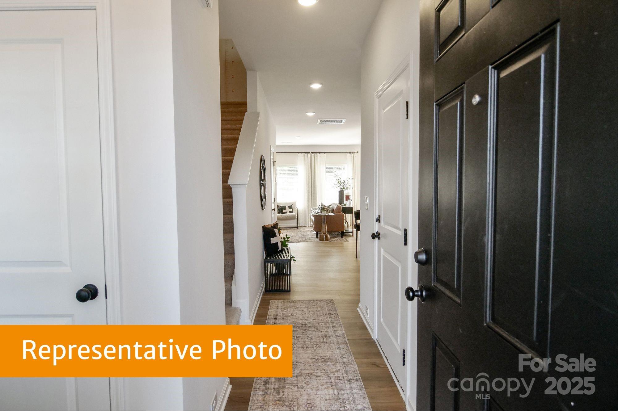 5620 Ringneck Road Charlotte, NC 28216 - Photo 13 of 24 a view of hallway with a door and a rug