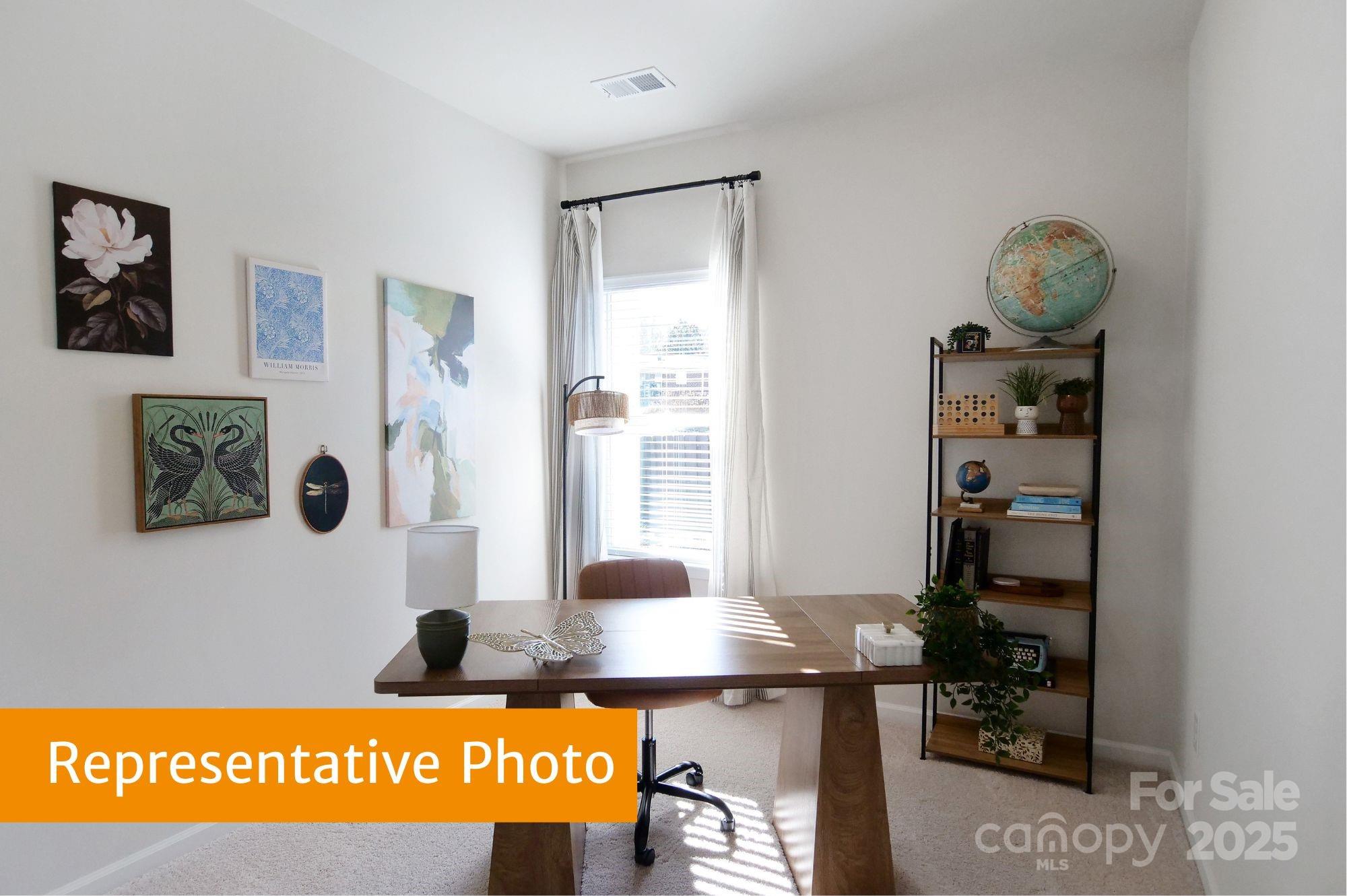 5620 Ringneck Road Charlotte, NC 28216 - Photo 17 of 24 a picture of a floor to ceiling window and a table