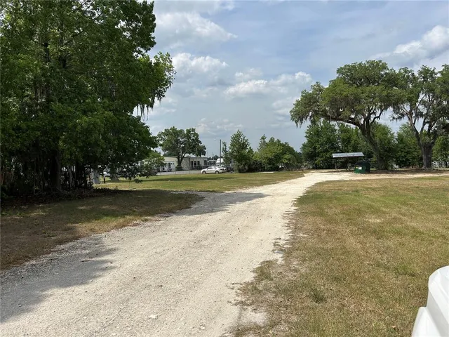 a view of outdoor space with swimming pool and green space