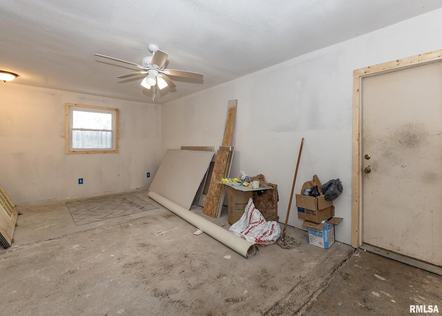 513 3rd Street Camanche, IA 52730 - Photo 4 of 13 a view of a room with gym equipment