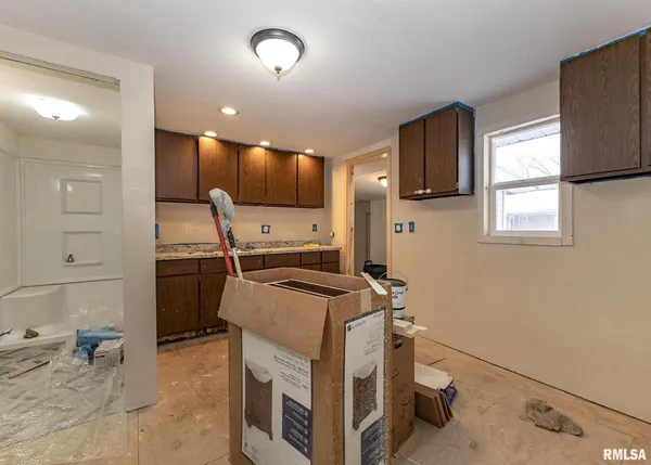 a view of a kitchen with appliances and cabinets