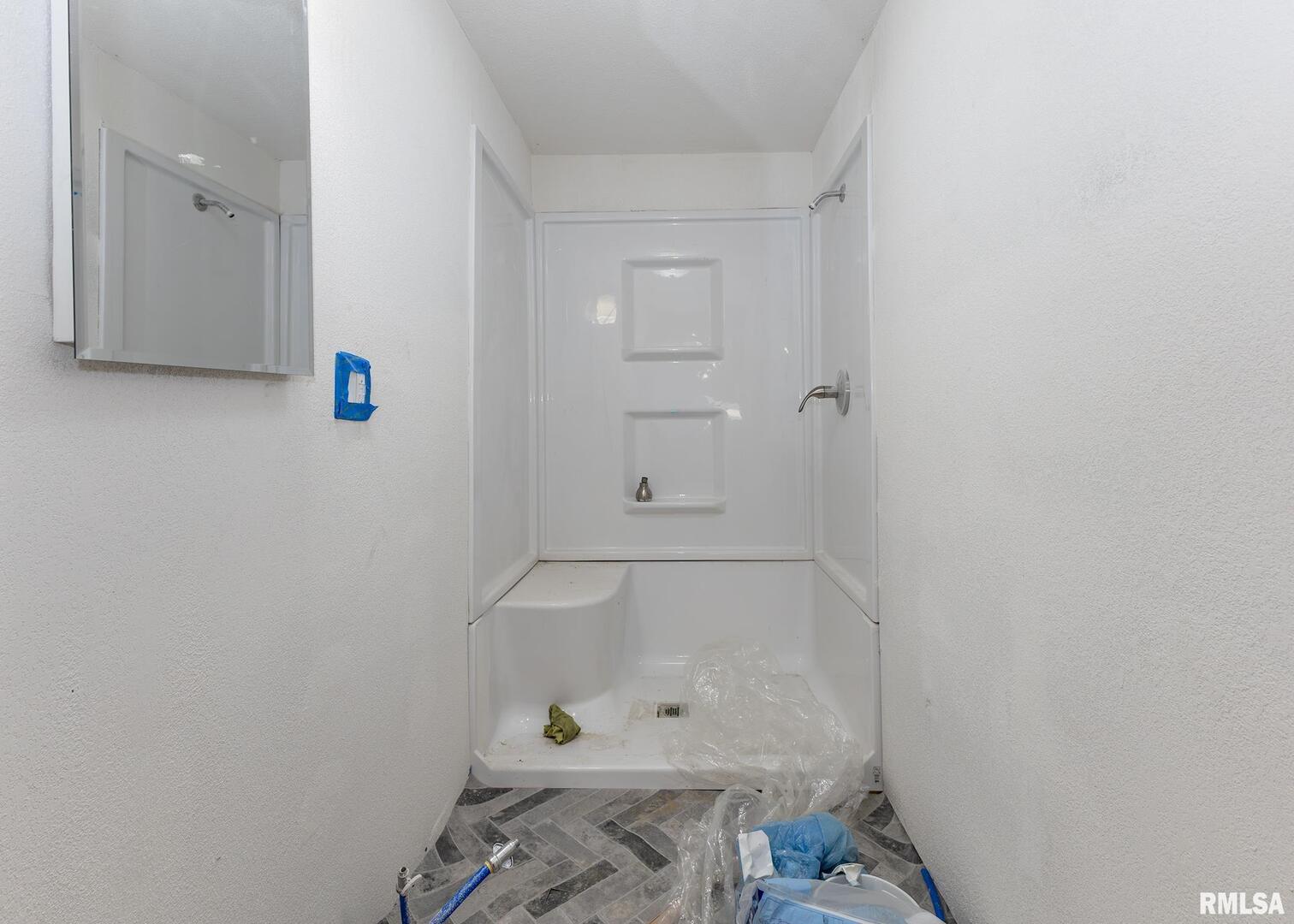 513 3rd Street Camanche, IA 52730 - Photo 10 of 13 a bathroom with a bathtub