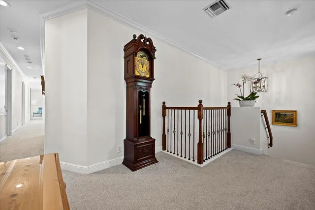 a living room with furniture a desk and chair with wooden floor
