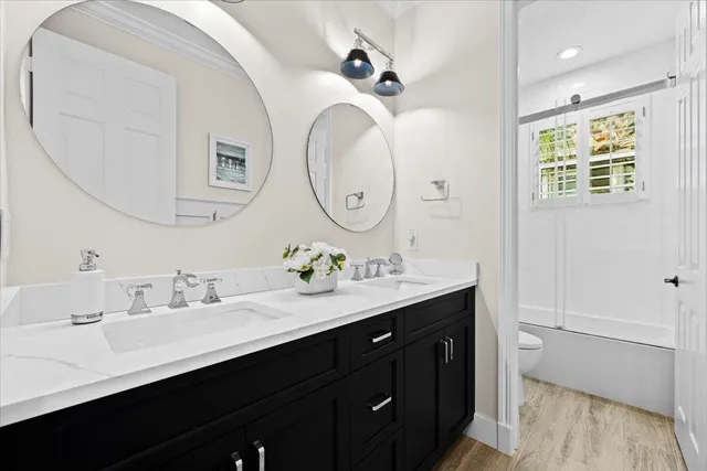 a front view of a house with a yard and a garage