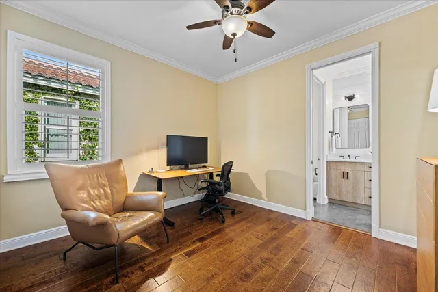 an aerial view of residential houses with outdoor space and lake view