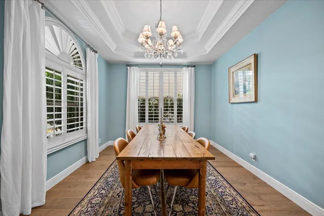 a kitchen with kitchen island granite countertop a sink cabinets stainless steel appliances and a counter top space