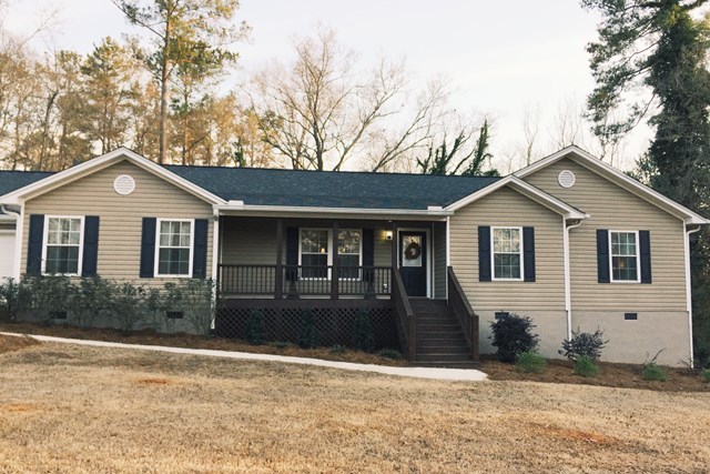 a front view of a house with yard