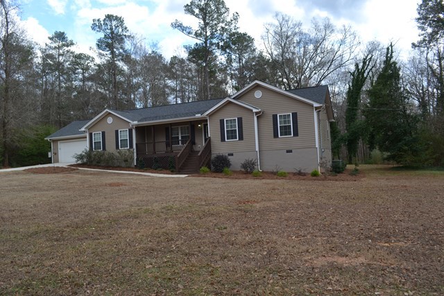 232 Sanders Road Macon, GA 31210 - Photo 2 of 33 a house with trees in the background