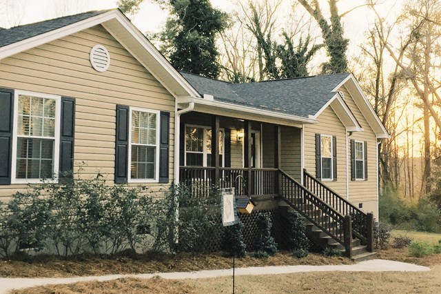 232 Sanders Road Macon, GA 31210 - Photo 13 of 33 a view of a white house with a potted plant and a large windows