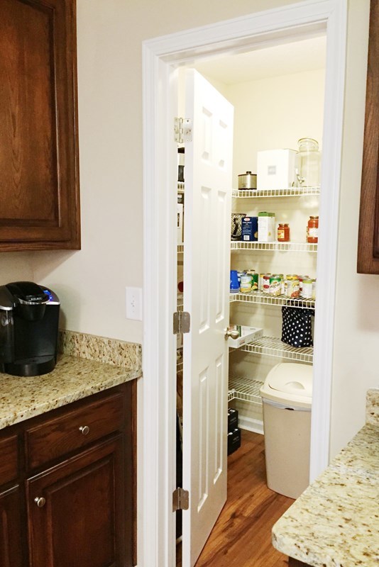 232 Sanders Road Macon, GA 31210 - Photo 20 of 33 a kitchen with a sink a stove and a refrigerator