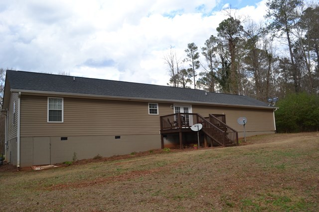 232 Sanders Road Macon, GA 31210 - Photo 3 of 33 a backyard of house with table and chairs
