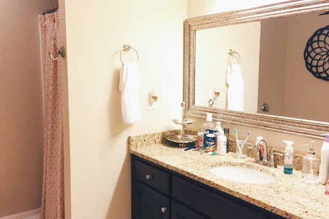 232 Sanders Road Macon, GA 31210 - Photo 31 of 33 a bathroom with a granite countertop sink and a mirror