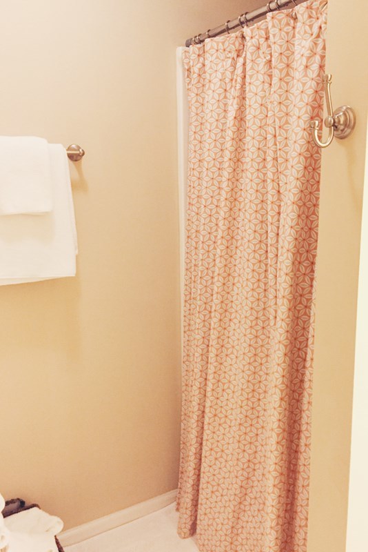232 Sanders Road Macon, GA 31210 - Photo 33 of 33 a bathroom with a shower curtain and toilet