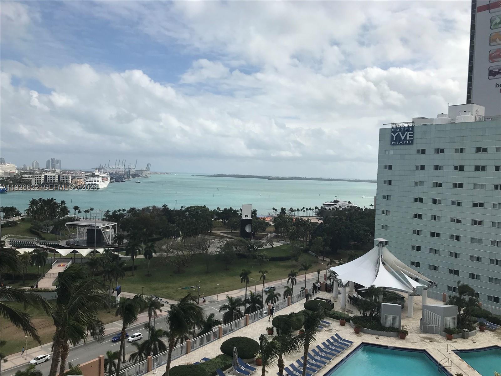 244 Biscayne Boulevard, Unit 1405 Miami, FL 33132 - Photo 1 of 13 a view of a lake with tall buildings