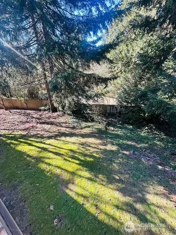 a view of a swimming pool with an outdoor space and seating area
