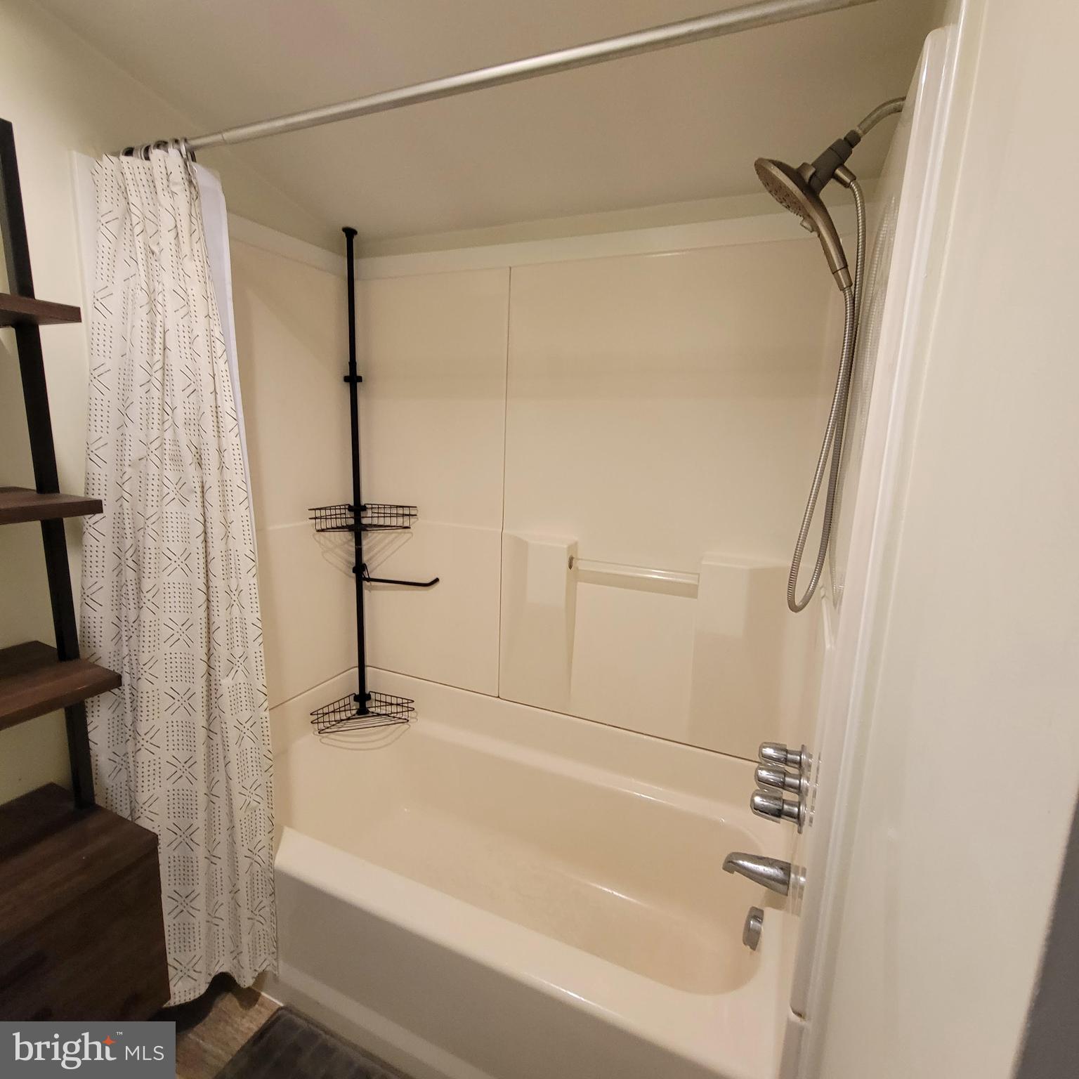 127 2nd Avenue Pitman, NJ 08071 - Photo 16 of 36 a bathroom with a bathtub and a shower