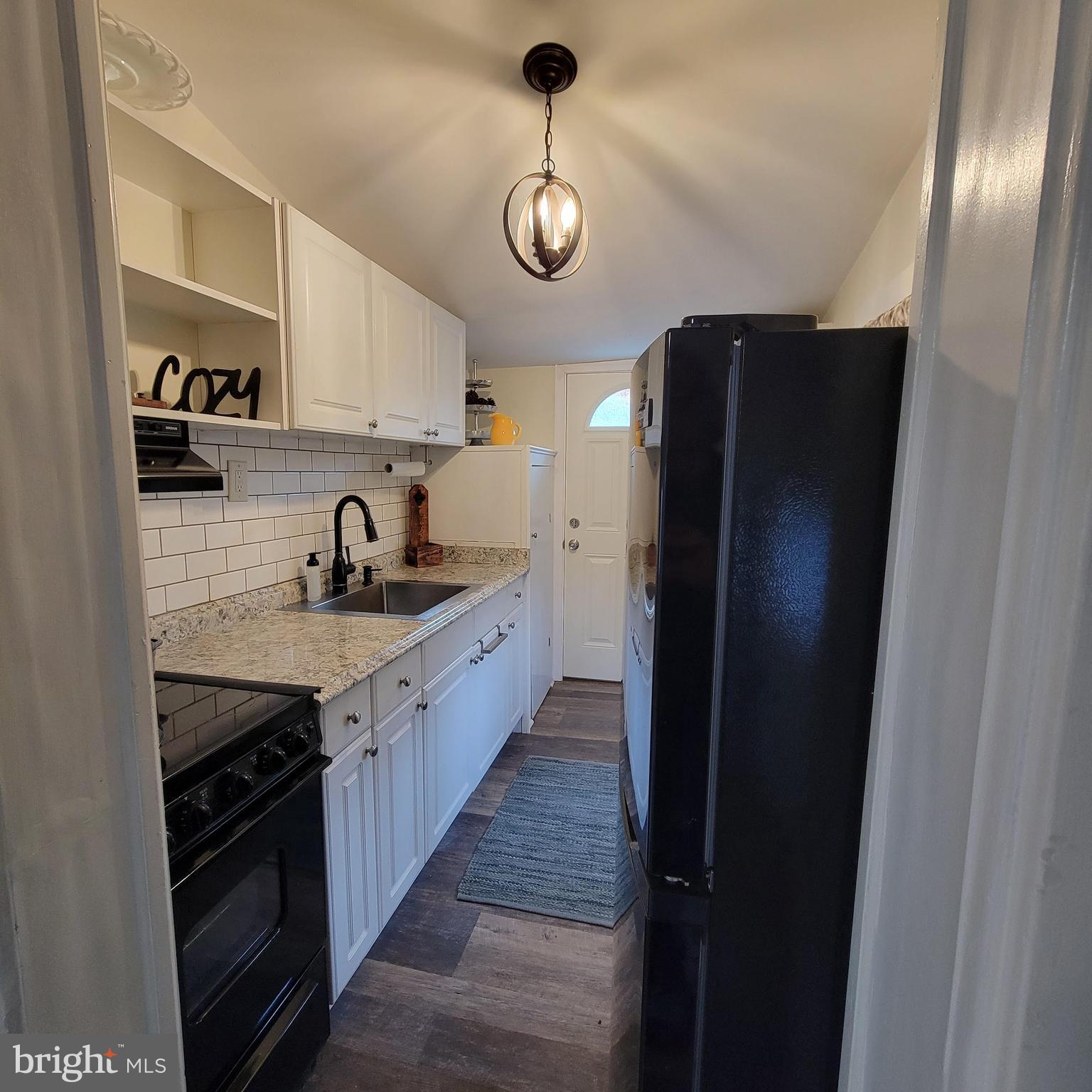 127 2nd Avenue Pitman, NJ 08071 - Photo 18 of 36 a kitchen with stainless steel appliances granite countertop a refrigerator and a sink