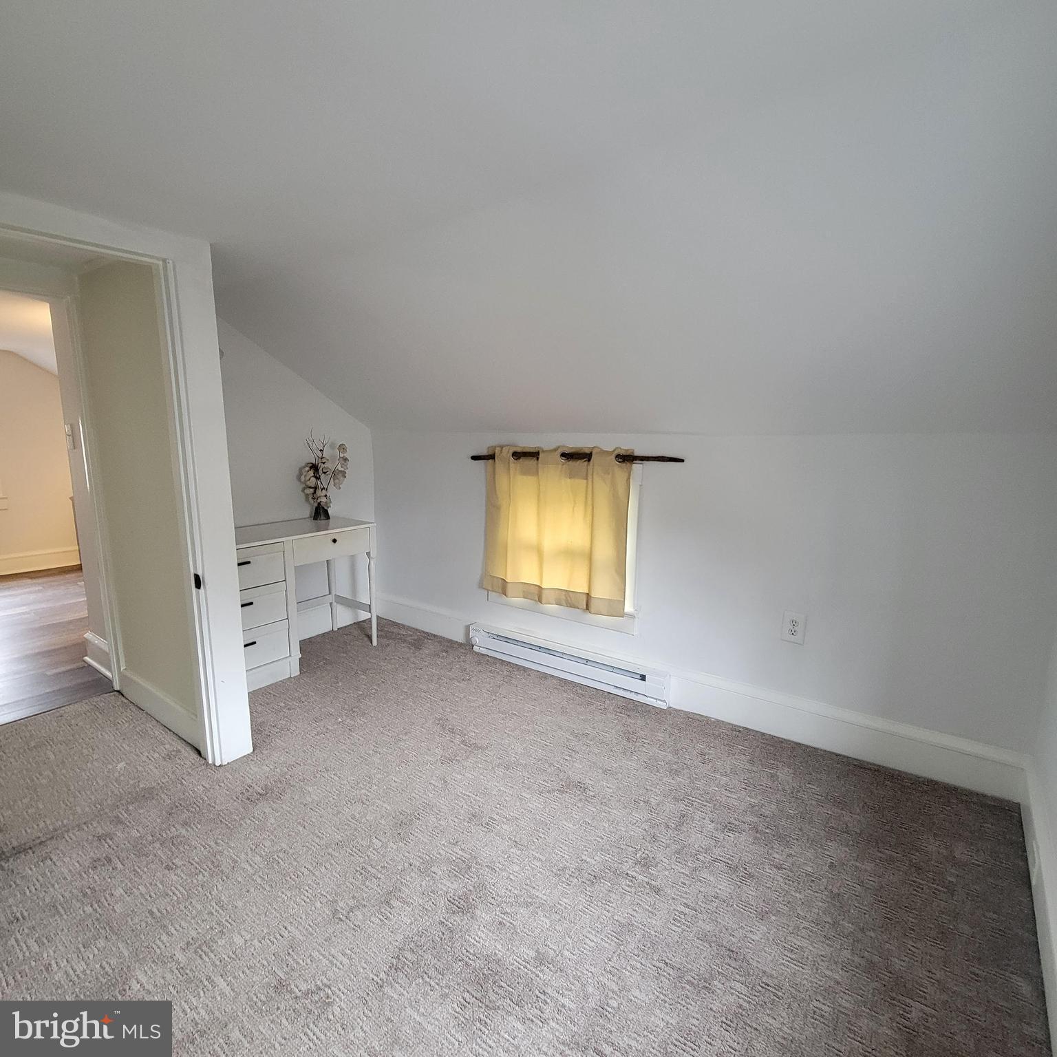 127 2nd Avenue Pitman, NJ 08071 - Photo 21 of 36 an empty room with a fireplace and painted walls