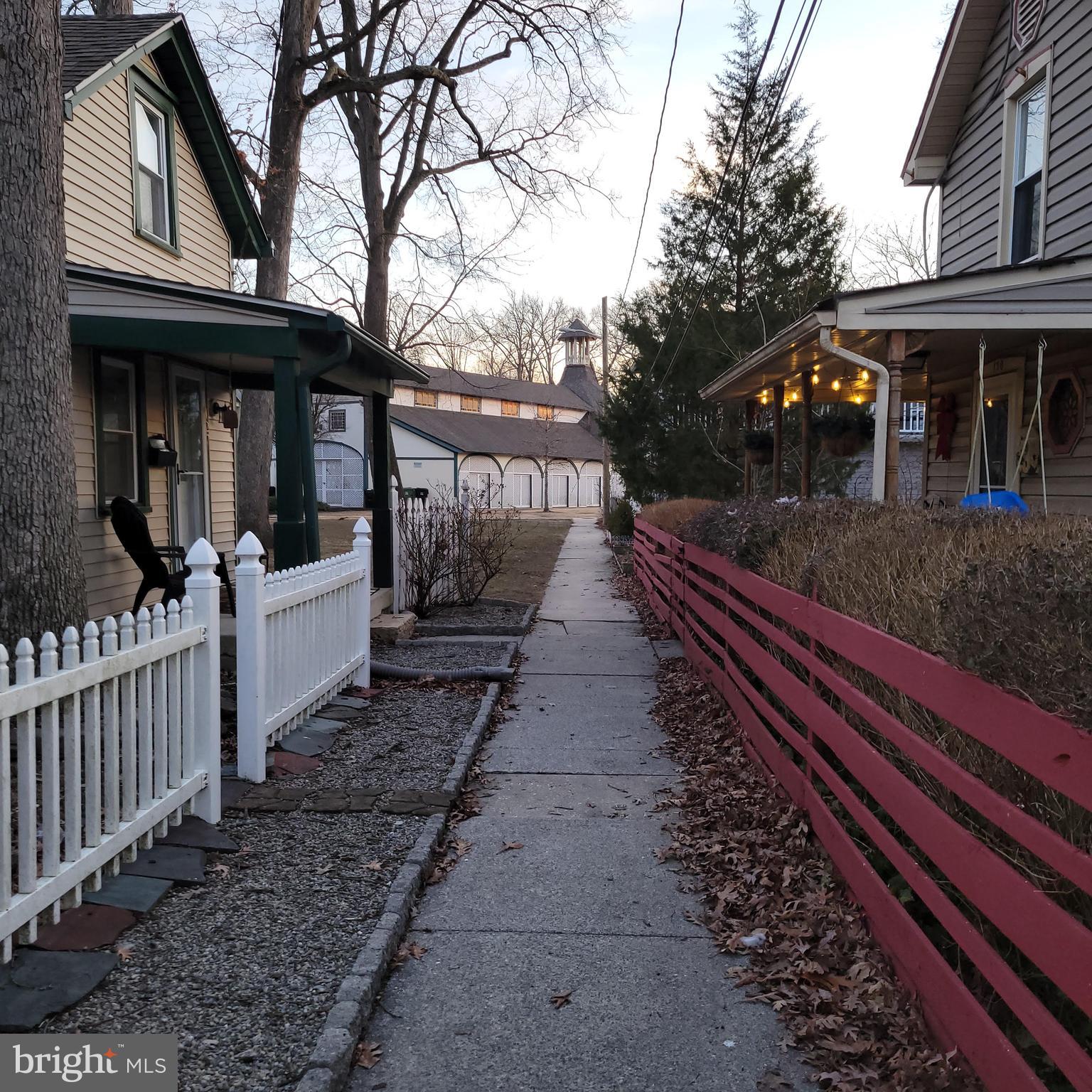 127 2nd Avenue Pitman, NJ 08071 - Photo 4 of 36 a view of a house with large windows and a pathway