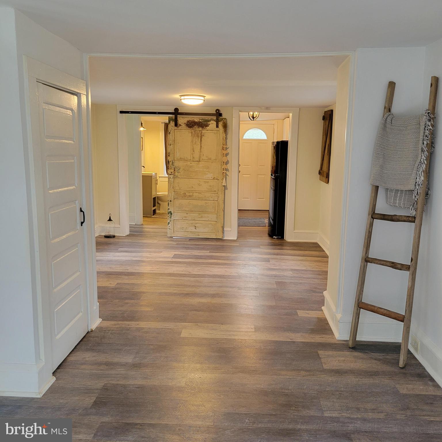 127 2nd Avenue Pitman, NJ 08071 - Photo 6 of 36 a view of empty room with wooden floor and stairs