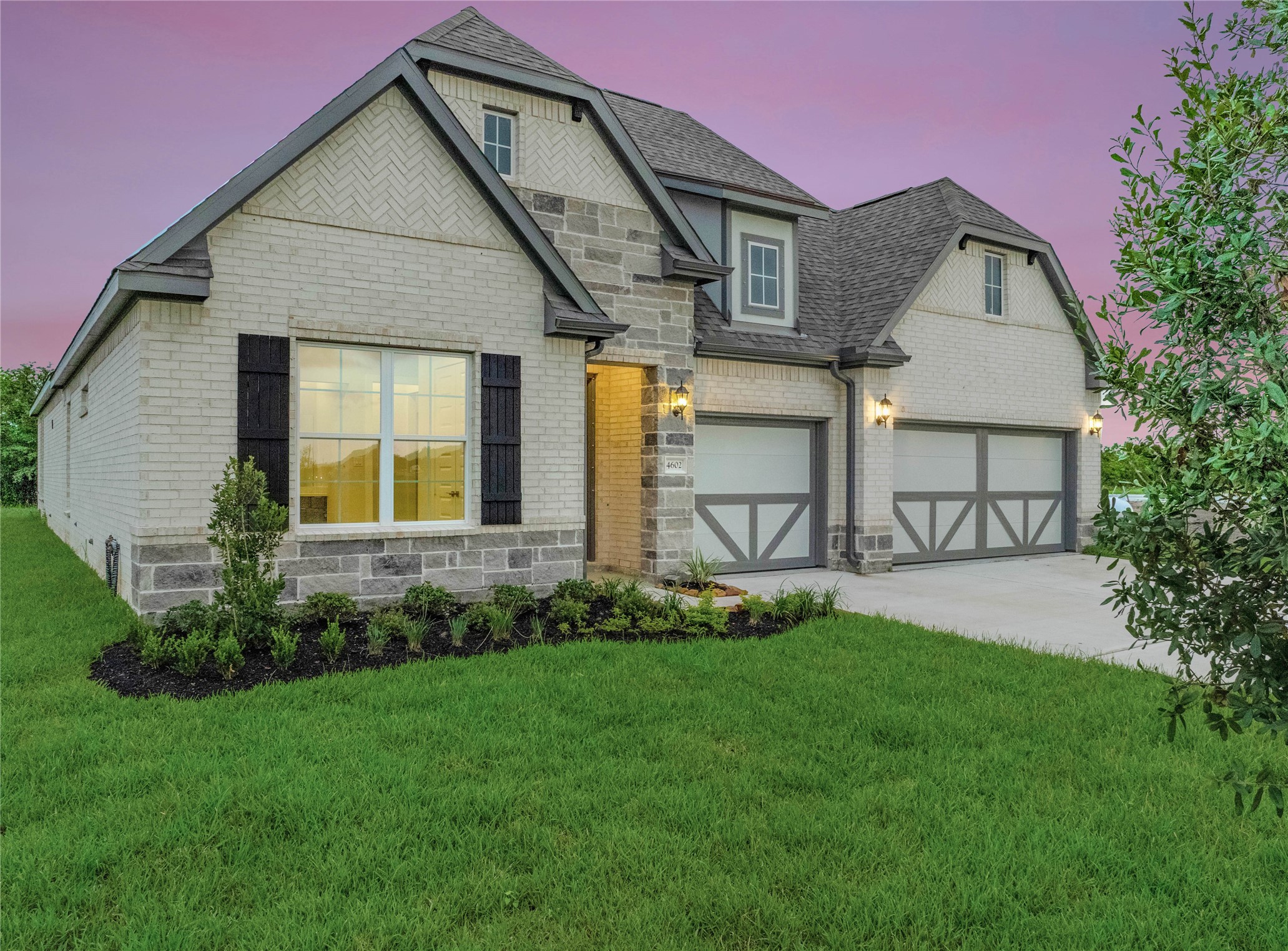 4602 Magnolia Bend Drive Rosharon, TX 77583 - Photo 2 of 39 a front view of a house with a garden